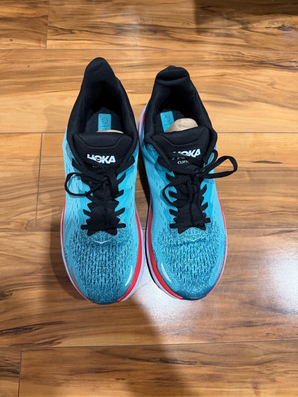 Hoka One One Women's Running Shoes in Teal and Black with Red Accent